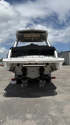  Yacht Photos Pics 2022 Formula 350 CBR boat, rear view, parked on gravel under cloudy sky.