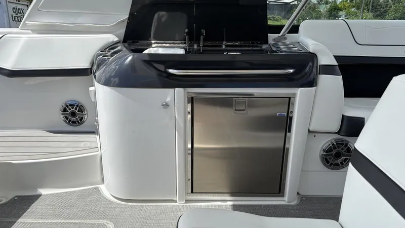  Yacht Photos Pics 2022 Formula 350 CBR boat interior with sleek kitchenette and stainless steel features.