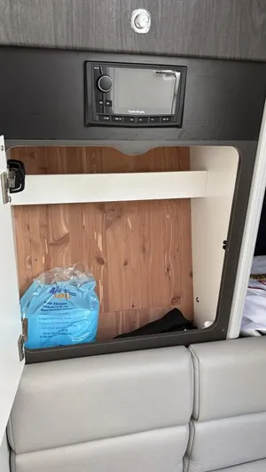  Yacht Photos Pics 2022 Formula 350 CBR interior cabinet with stereo system and storage space.