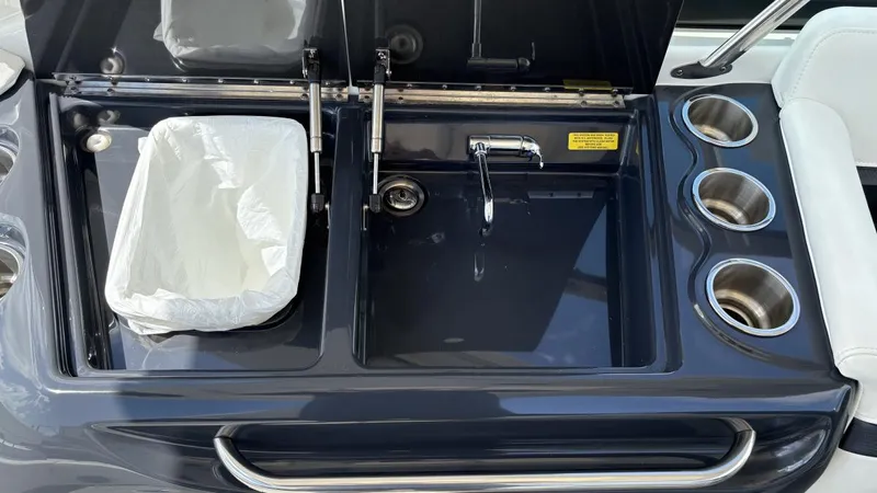  Yacht Photos Pics 2022 Formula 350 CBR boat sink and trash compartment with cup holders.