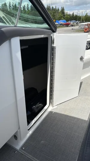  Yacht Photos Pics 2022 Formula 350 CBR boat storage compartment with open door, showcasing interior space.