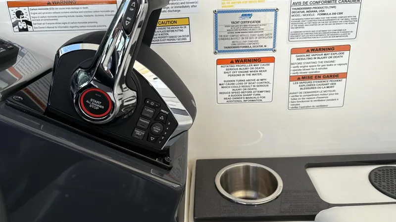  Yacht Photos Pics Control panel of 2022 Formula 350 CBR boat with warning labels and cup holder.