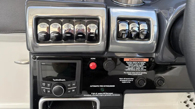  Yacht Photos Pics Control panel of a 2022 Formula 350 CBR boat with switches and audio system.