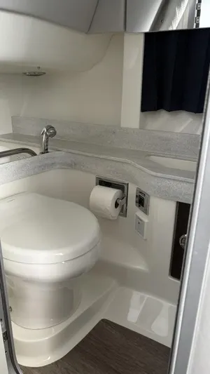  Yacht Photos Pics 2022 Formula 350 CBR boat bathroom with modern fixtures and compact design.