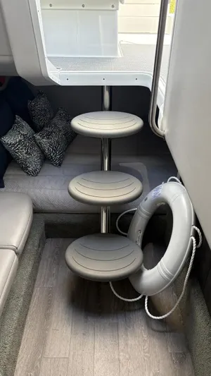  Yacht Photos Pics Interior of 2022 Formula 350 CBR boat with circular steps and a life preserver.