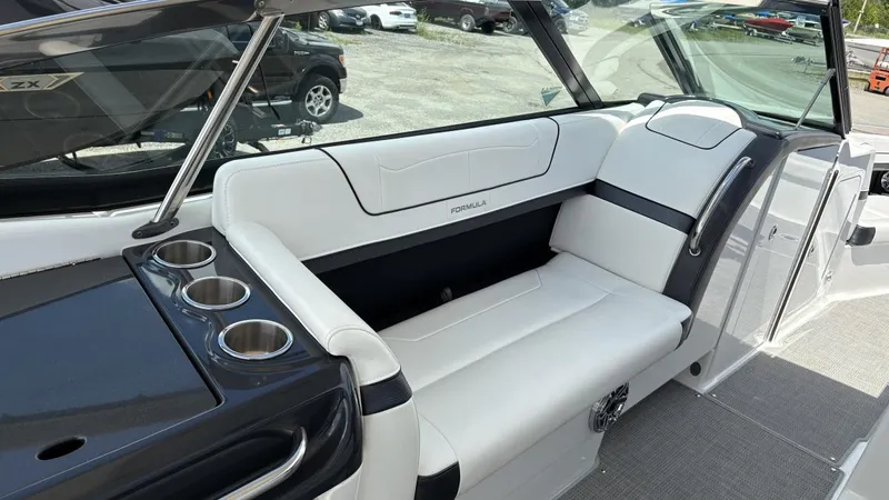  Yacht Photos Pics 2022 Formula 350 CBR boat interior with white seating and cup holders.