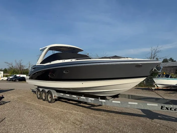  Yacht Photos Pics 2022 Formula 350 CBR boat on trailer under clear blue sky.