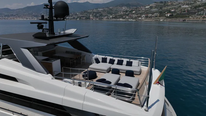 Aman - Sanlorenzo Sl96 Yacht Photos Pics Luxurious 2016 Sanlorenzo SL96 yacht with spacious deck and scenic coastal backdrop.