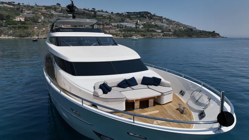 Aman - Sanlorenzo Sl96 Yacht Photos Pics Sanlorenzo SL96 2016 yacht with luxurious deck seating, cruising near scenic coastline.