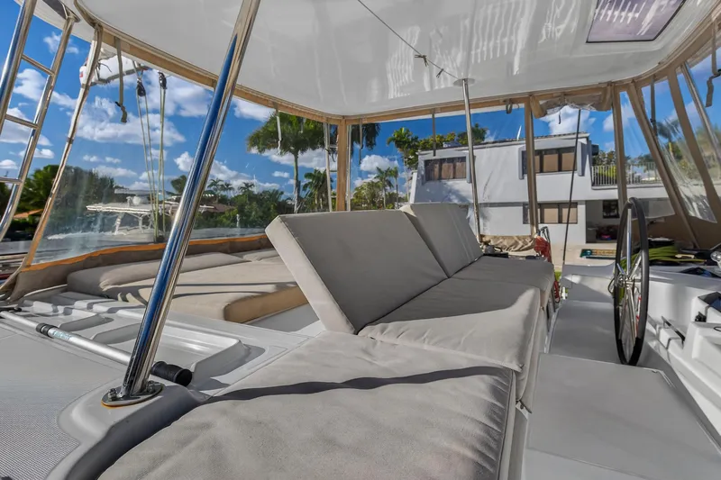 White Heron Yacht Photos Pics Luxurious 2021 Lagoon 46 Owner's Version catamaran interior with comfortable seating and modern design.