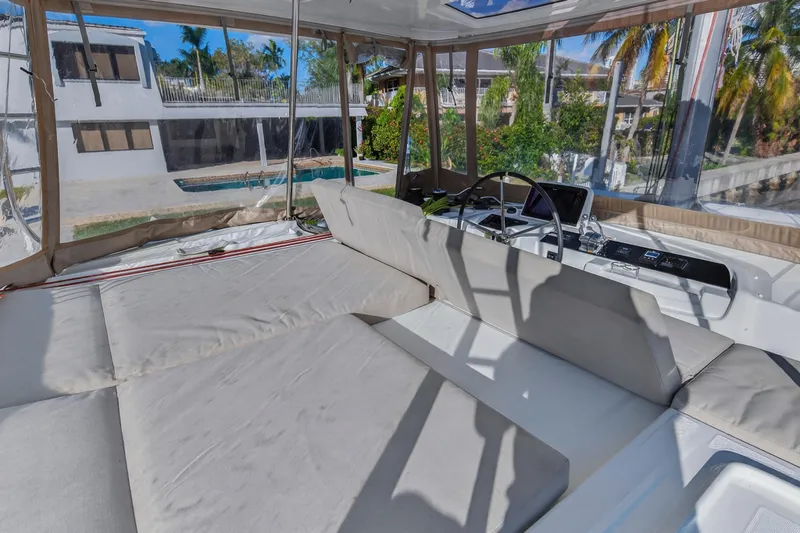 White Heron Yacht Photos Pics Luxurious Lagoon 46 Owner's Version 2021 yacht interior with spacious seating and helm.