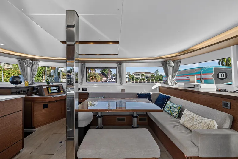 White Heron Yacht Photos Pics Luxurious interior of 2021 Lagoon 46 Owner's Version catamaran with modern furnishings.
