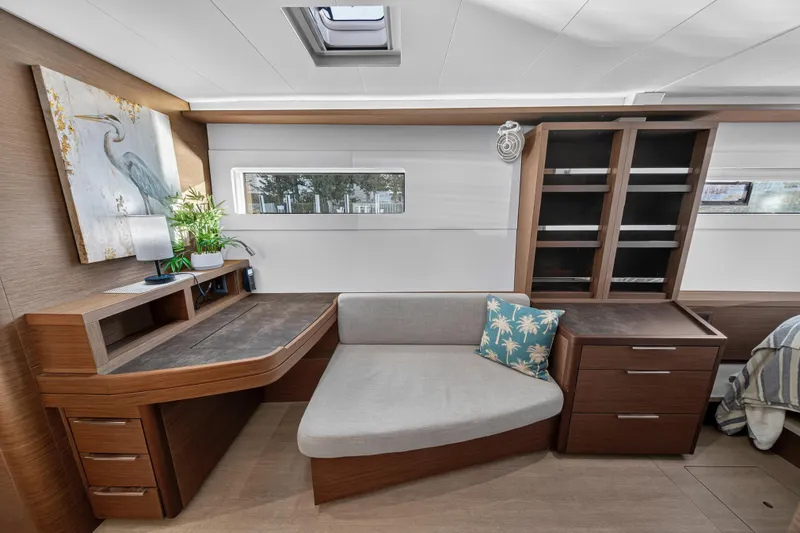 White Heron Yacht Photos Pics Luxurious interior of 2021 Lagoon 46 Owner's Version yacht with modern furnishings and decor.