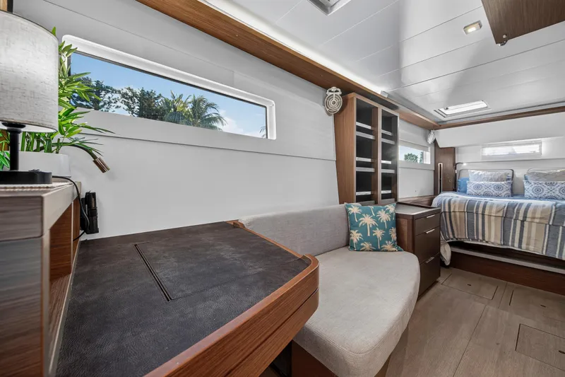 White Heron Yacht Photos Pics Luxurious interior of 2021 Lagoon 46 Owner's Version yacht with modern furnishings.