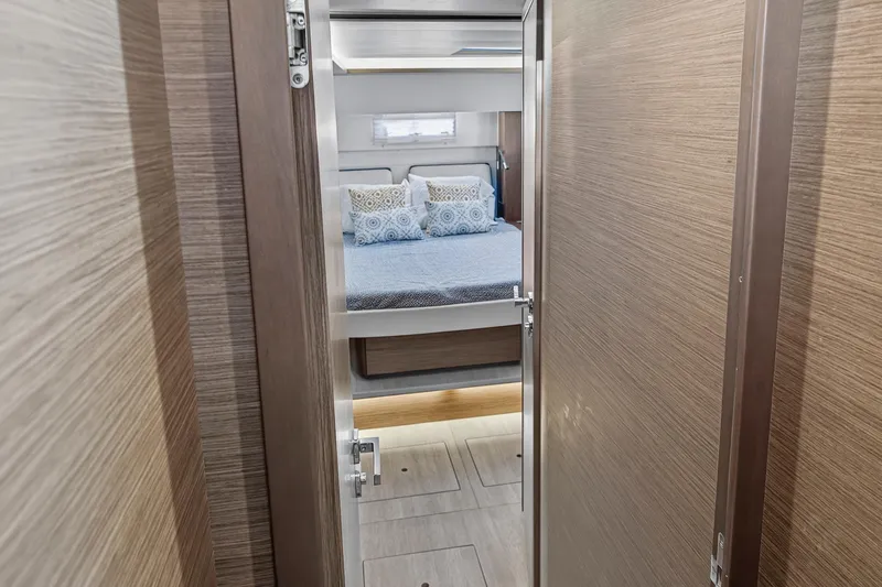 White Heron Yacht Photos Pics Interior view of 2021 Lagoon 46 Owner's Version yacht bedroom with modern decor.