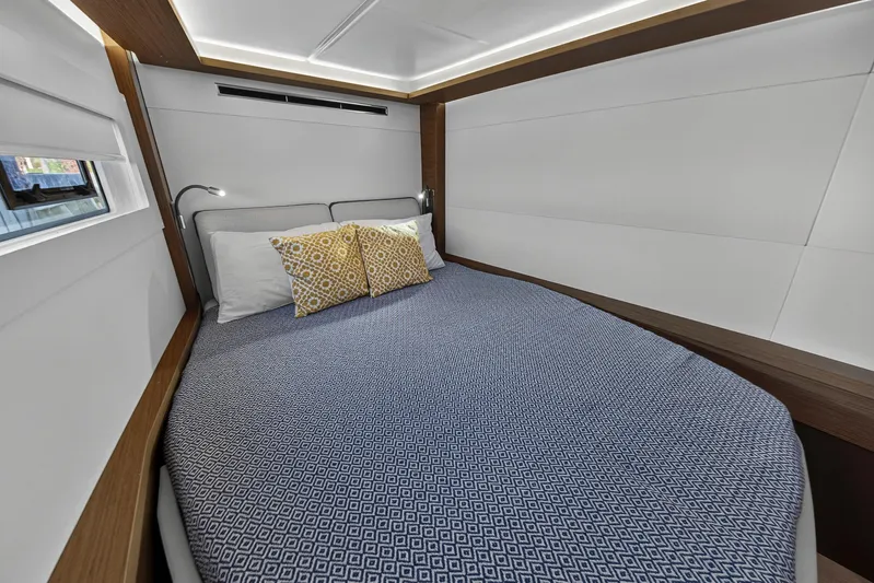 White Heron Yacht Photos Pics Luxurious bedroom interior of 2021 Lagoon 46 Owner's Version yacht with modern design.