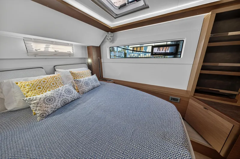 White Heron Yacht Photos Pics Luxurious bedroom interior of 2021 Lagoon 46 Owner's Version yacht with modern design.