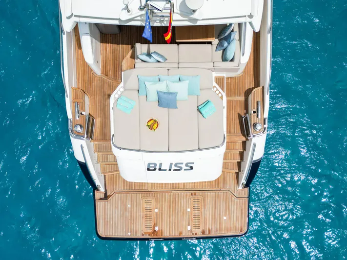  Yacht Photos Pics Luxurious 2016 Princess V72 yacht "Bliss" with elegant deck and cushions on turquoise water.