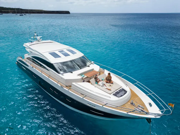  Yacht Photos Pics Luxurious 2016 Princess V72 yacht cruising on clear blue waters.
