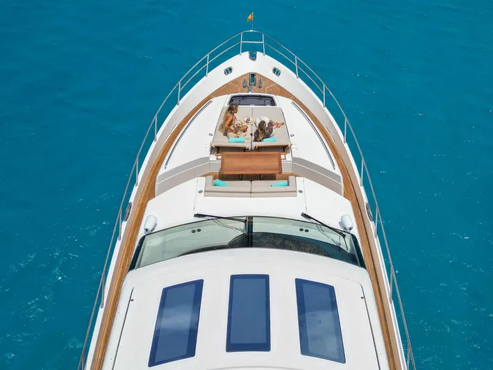  Yacht Photos Pics Luxurious 2016 Princess V72 yacht cruising on clear blue waters.