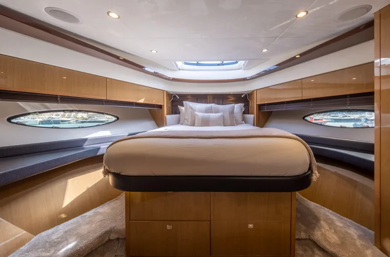  Yacht Photos Pics Luxurious 2016 Princess V72 yacht bedroom with elegant wood finishes and modern design.
