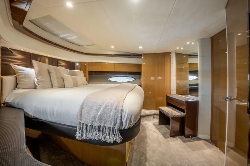  Yacht Photos Pics Luxurious bedroom interior of 2016 Princess V72 yacht with modern design and elegant furnishings.