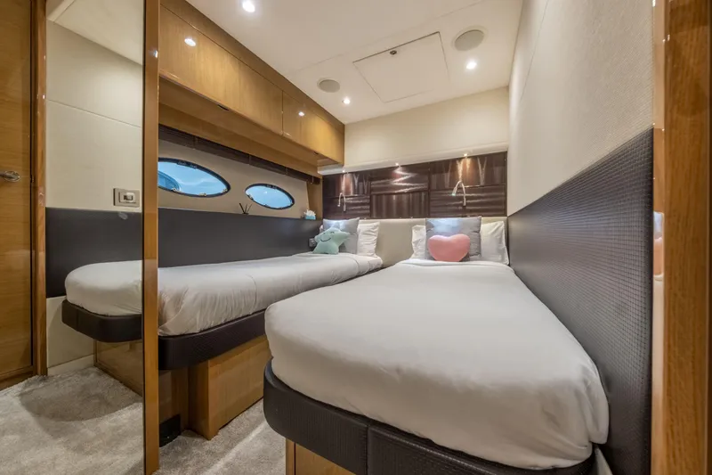  Yacht Photos Pics Luxurious 2016 Princess V72 yacht cabin with twin beds and elegant decor.