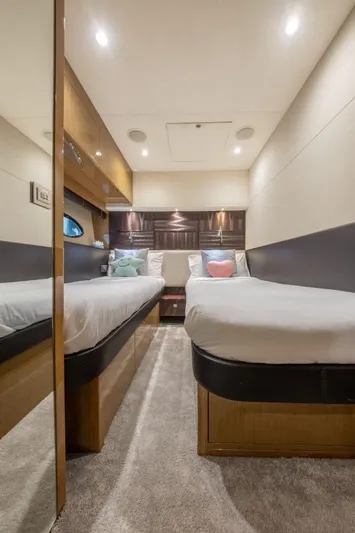  Yacht Photos Pics Interior of 2016 Princess V72 yacht with twin beds and modern decor.