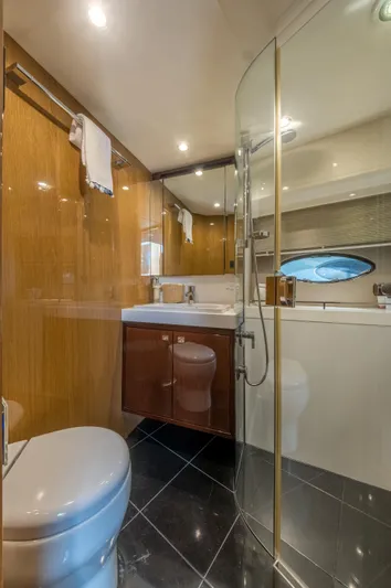  Yacht Photos Pics Luxurious bathroom on 2016 Princess V72 yacht with modern fixtures and elegant design.