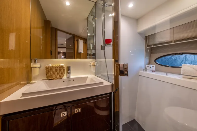  Yacht Photos Pics Luxurious bathroom interior of 2016 Princess V72 yacht with modern fixtures and elegant design.