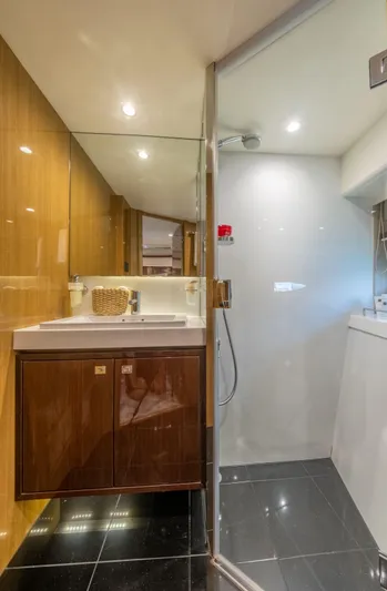  Yacht Photos Pics Luxurious bathroom on 2016 Princess V72 yacht with modern fixtures and elegant design.