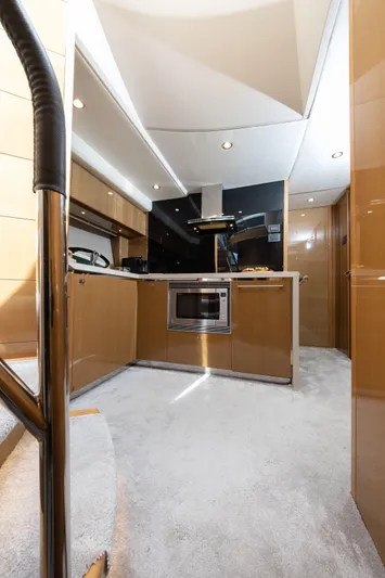  Yacht Photos Pics Luxurious interior of a 2016 Princess V72 yacht kitchen with modern appliances.