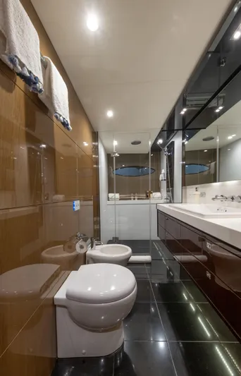  Yacht Photos Pics Luxurious bathroom on 2016 Princess V72 yacht with modern fixtures and elegant design.