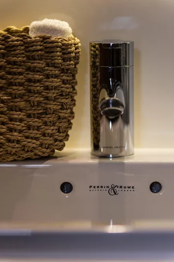  Yacht Photos Pics Woven basket and chrome container on Perrin & Rowe shelf, Princess V72 yacht, 2016.