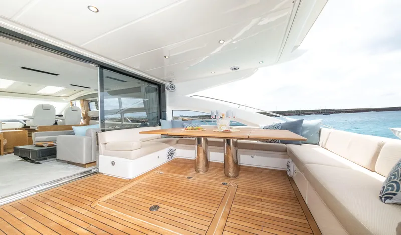  Yacht Photos Pics Luxurious 2016 Princess V72 yacht with elegant outdoor seating and dining area.