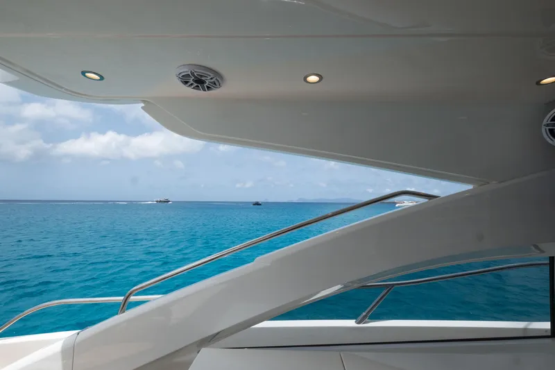  Yacht Photos Pics 2016 Princess V72 yacht deck overlooking clear blue ocean waters.