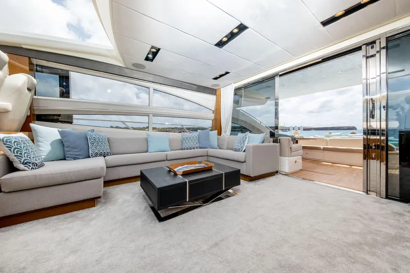  Yacht Photos Pics Luxurious interior of 2016 Princess V72 yacht with modern seating and ocean view.