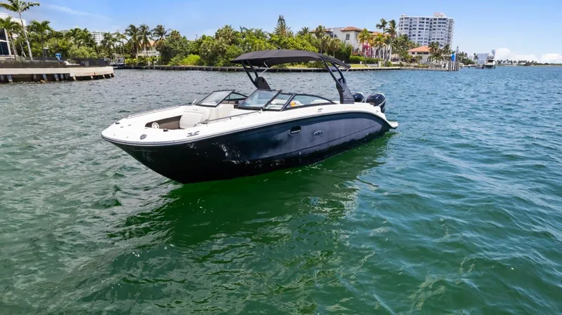  Yacht Photos Pics 2018 Sea Ray SDX 290 boat on calm water near a coastal area.