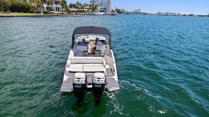  Yacht Photos Pics 2018 Sea Ray SDX 290 boat cruising on clear blue water.