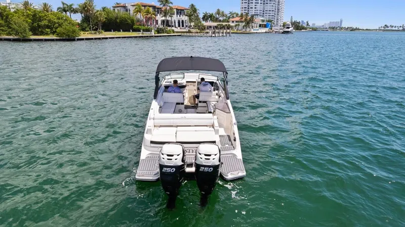  Yacht Photos Pics 2018 Sea Ray SDX 290 boat with dual engines on a sunny waterway.