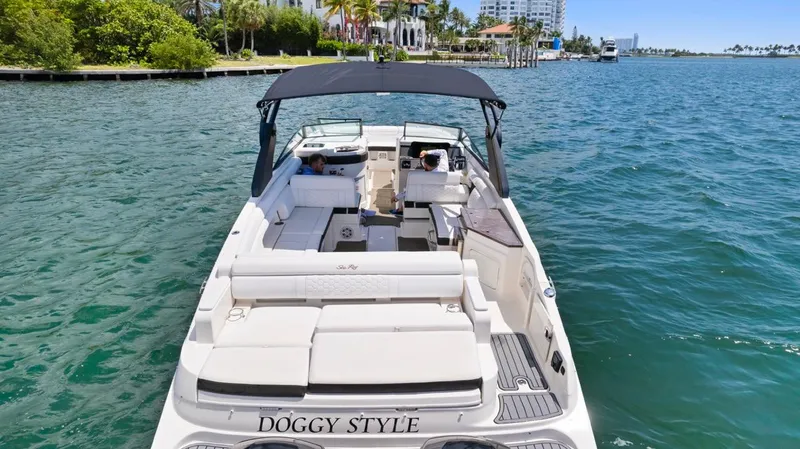  Yacht Photos Pics 2018 Sea Ray SDX 290 boat on water, rear view, with canopy and seating.