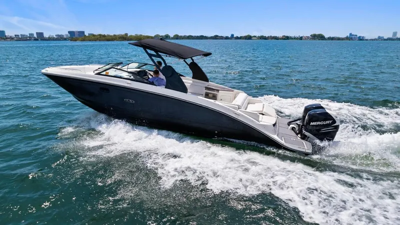 Yacht Photos Pics 2018 Sea Ray SDX 290 boat cruising on open water under clear blue skies.