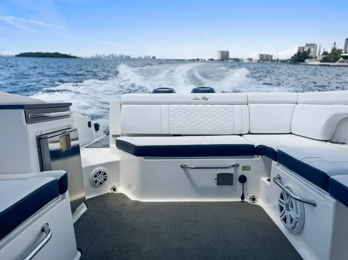  Yacht Photos Pics 2018 Sea Ray SDX 290 boat interior with white seating, cruising on open water.
