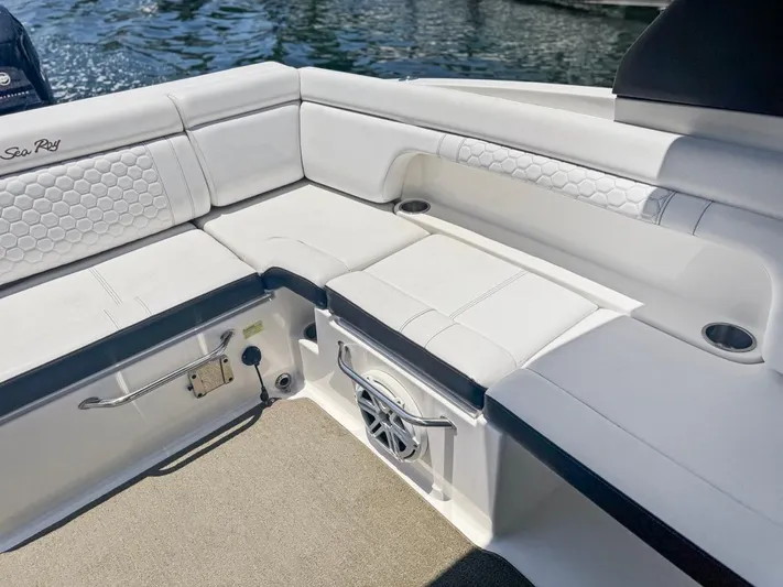  Yacht Photos Pics 2018 Sea Ray SDX 290 boat interior with white cushioned seating and speaker.