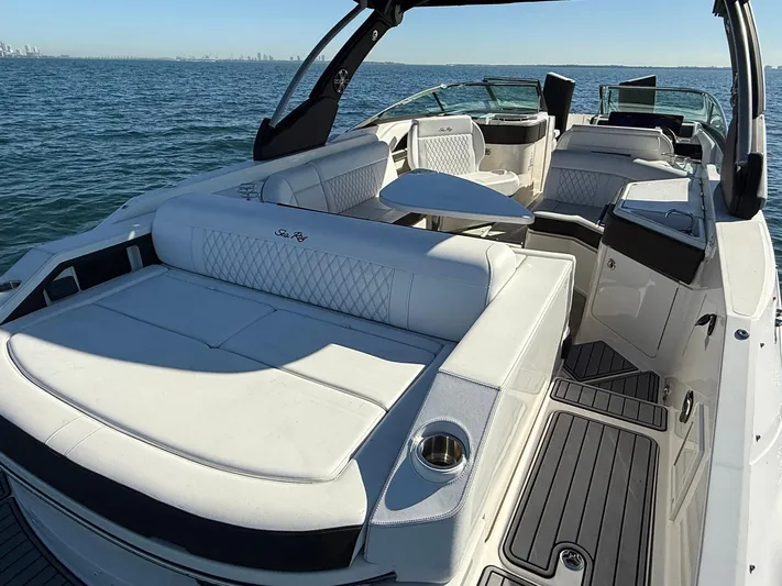  Yacht Photos Pics 2019 Sea Ray SLX 310 boat with luxurious seating on open water.