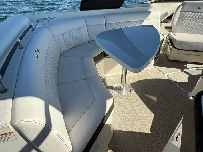  Yacht Photos Pics Luxurious 2019 Sea Ray SLX 310 boat interior with elegant seating and table.