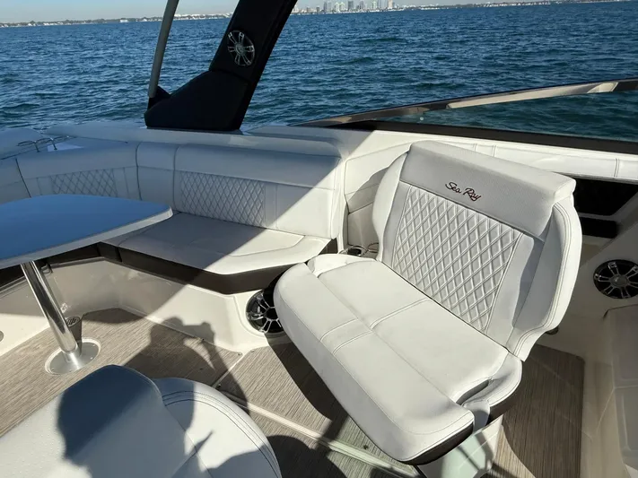  Yacht Photos Pics Luxurious 2019 Sea Ray SLX 310 boat interior with white leather seating and ocean view.