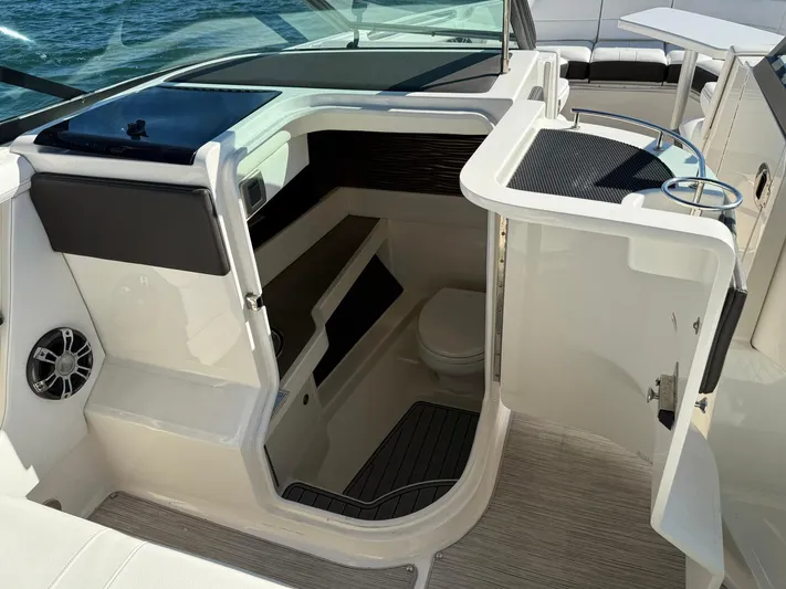  Yacht Photos Pics 2019 Sea Ray SLX 310 boat interior with cabin and seating area.