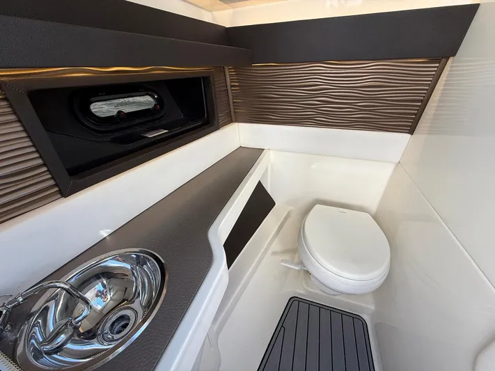  Yacht Photos Pics 2019 Sea Ray SLX 310 boat bathroom with sink, toilet, and modern design.