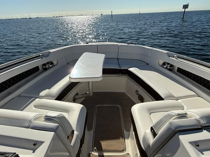  Yacht Photos Pics 2019 Sea Ray SLX 310 boat interior with seating and table on open water.